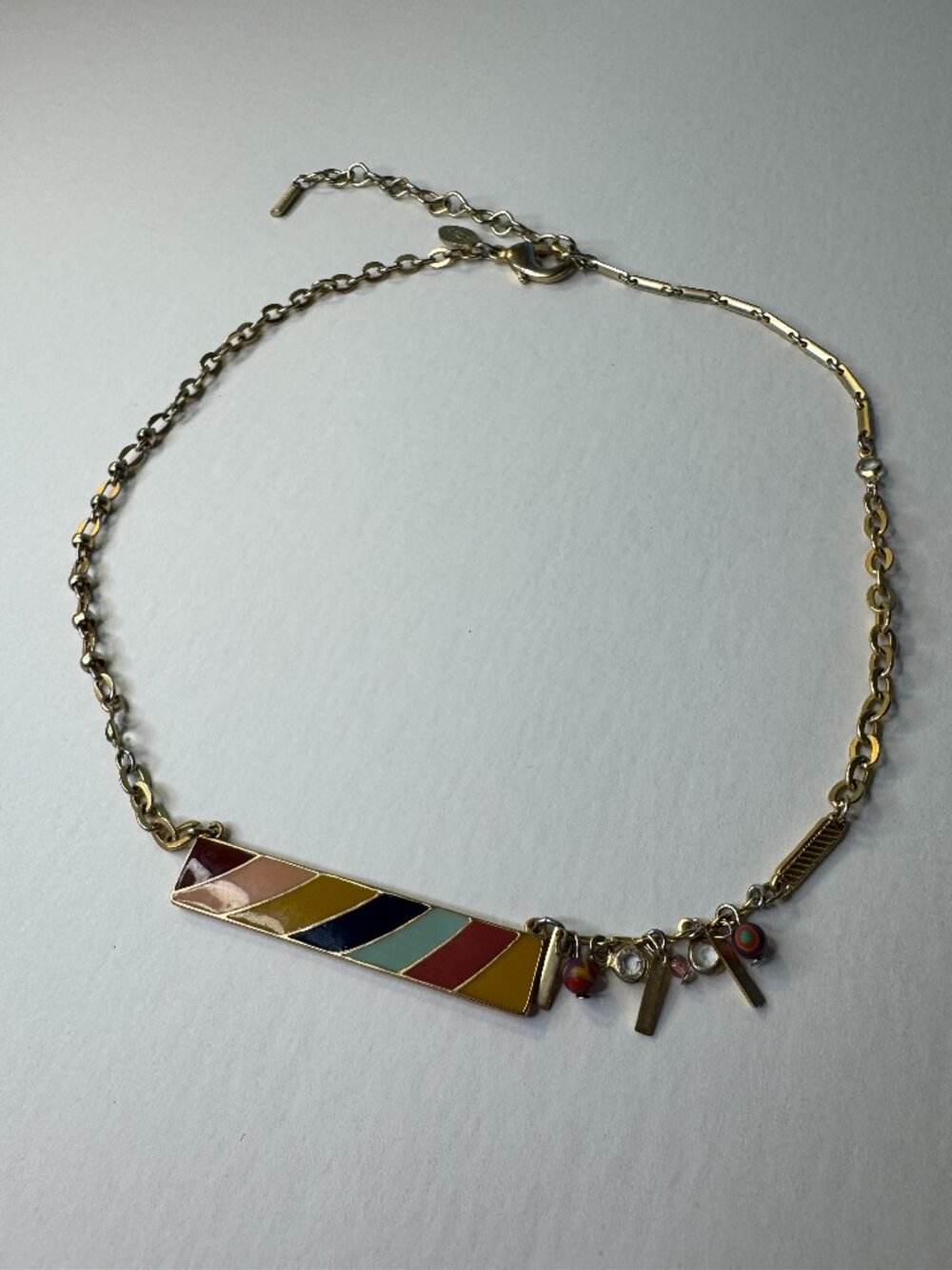 Chico's gold and colored enamel bar necklace with charms